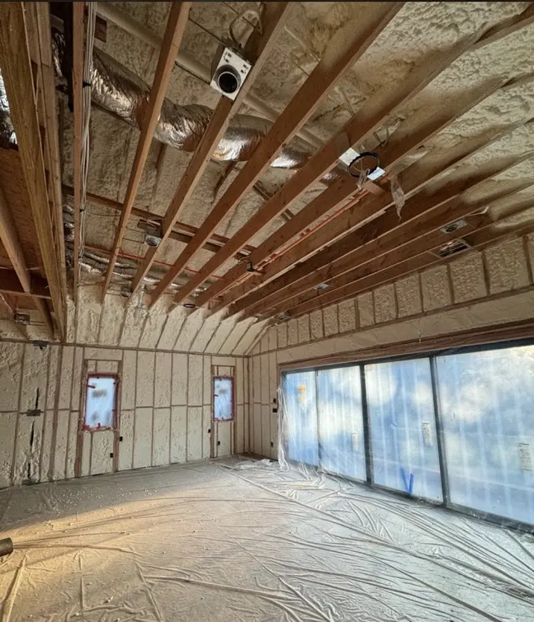 Interior walls and ceiling insulated with spray foam during new construction in Grand Prairie
